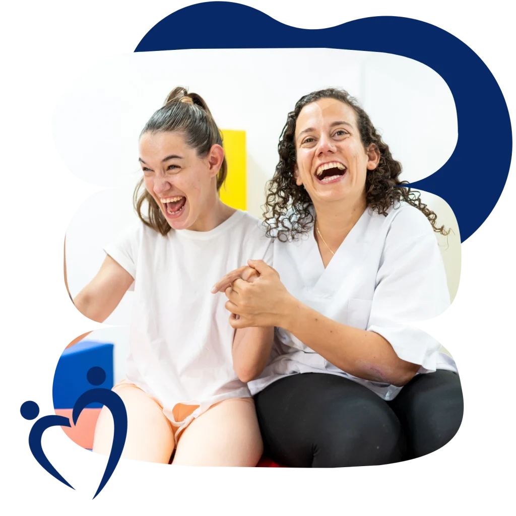 Disabled woman smiling and laughing with support worker