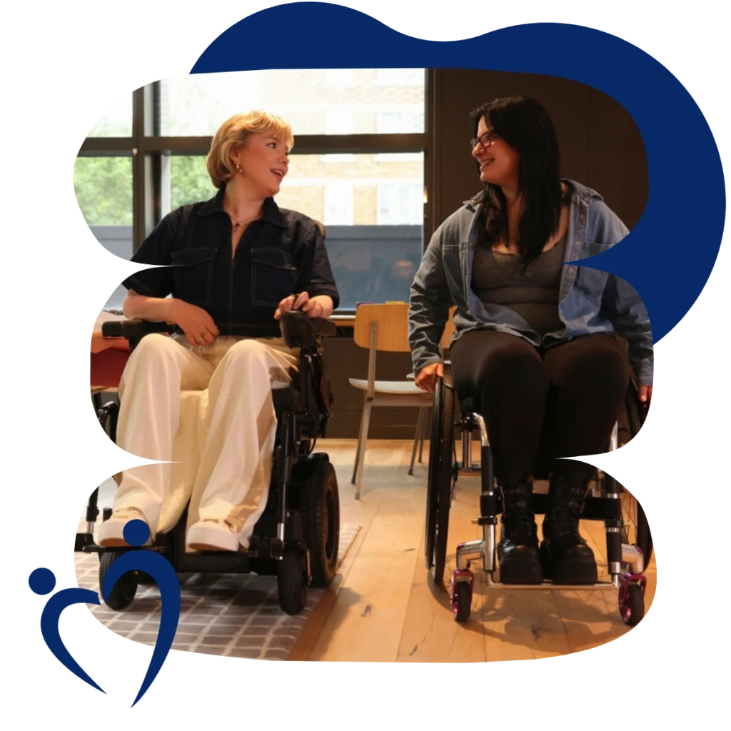 Two disabled friends in wheelchairs talking